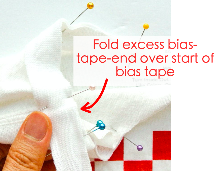 How to alter crew neck t shirt neckline. Folding excess bias tape end over start of bias tape