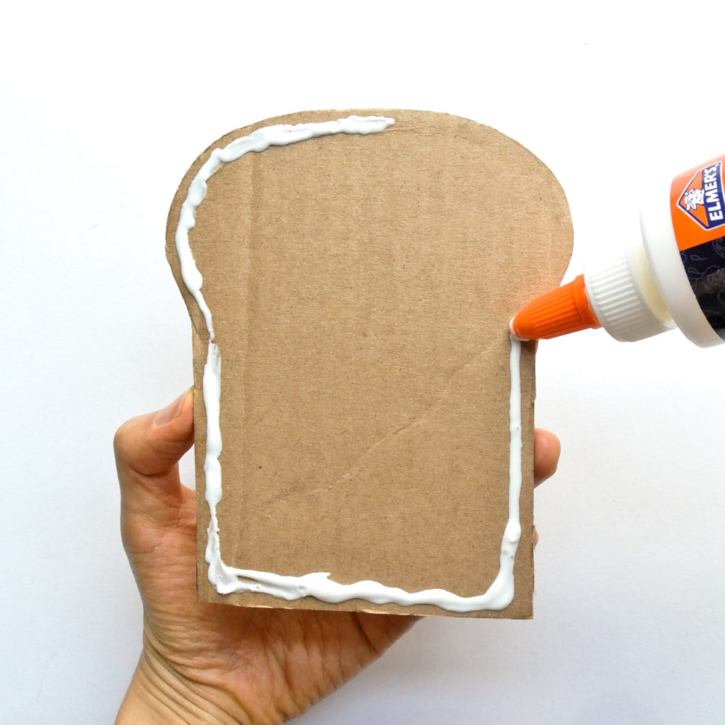 Placing glue on Cardboard Sandwich Felt Food
