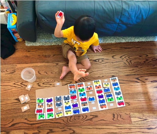 Shows a toddler trying to match train letters on the ABC train letter Matching toddler activity