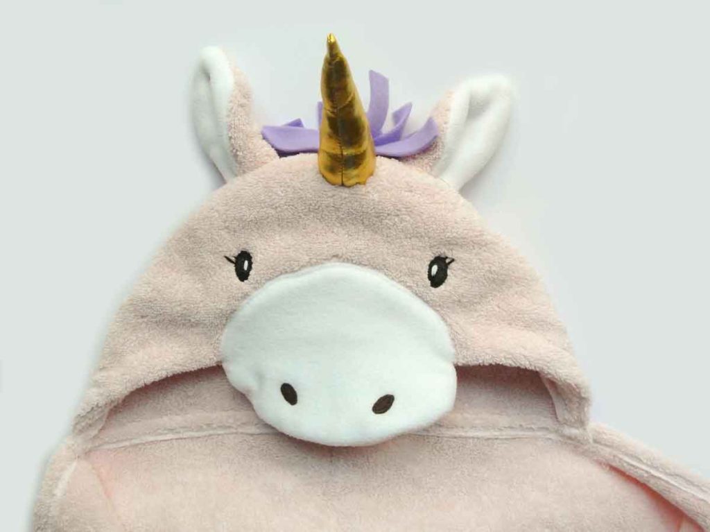 Front view of DIY Unicorn Hooded Towel with horn sewn on