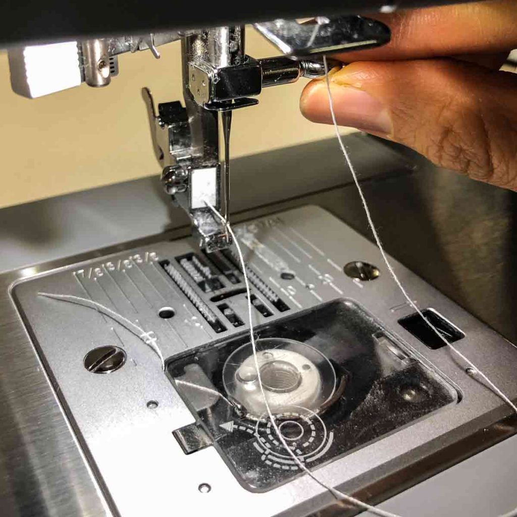 Tightening needle back into sewing machine