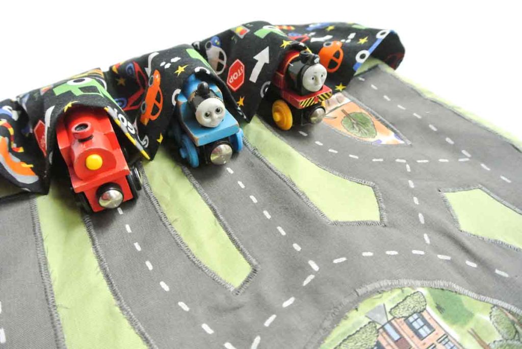 Finished DIY Toy Car Play mat Carrier Case with trains tucked into pocket.