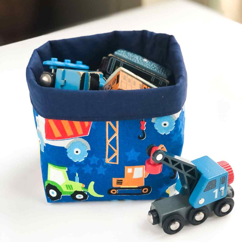 Finished Fabric bin holding wooden magnetic toy trains