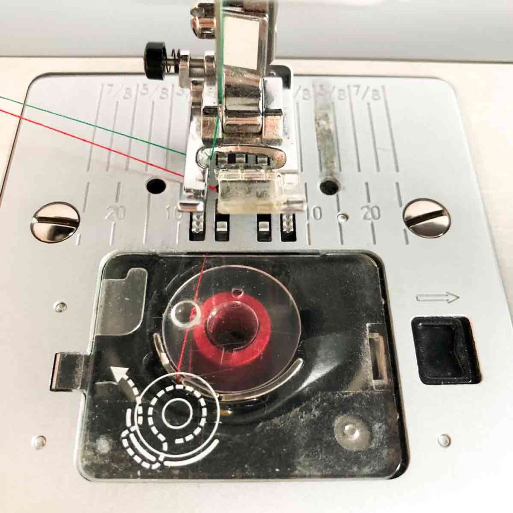 How to thread the bobbin. A top loading sewing machine with bobbin in place.