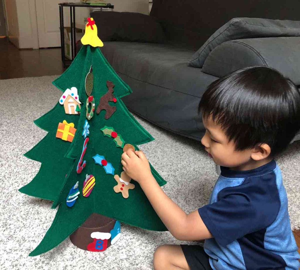 How to make a 3D Felt Christmas tree with free pattern. Shows toddler decorating felt tree with no sew felt ornaments