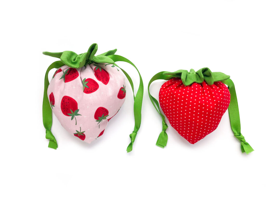 Finished strawberry drawstring pouches in size small and medium.