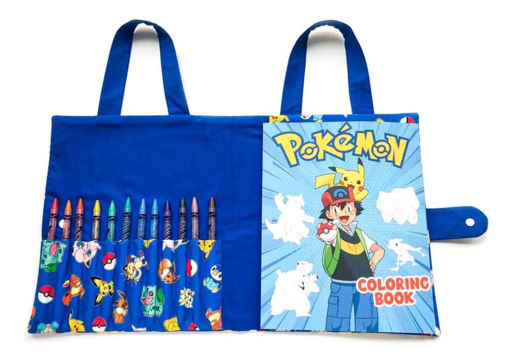 Inside of finished coloring book and crayon holder with Pokemon coloring book and 12 coloring pencils