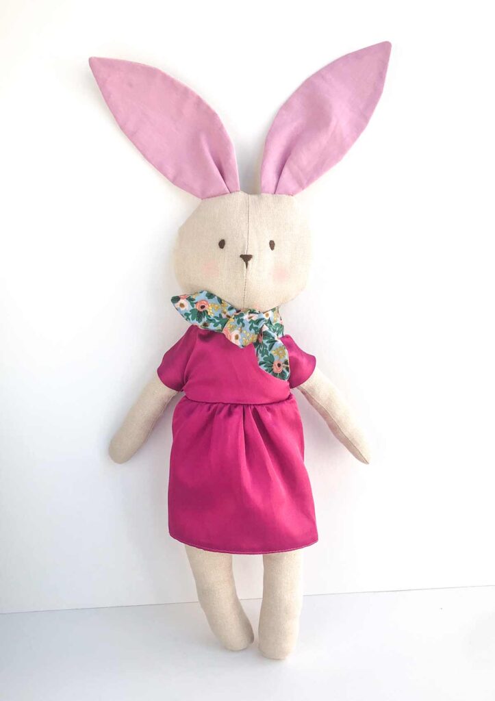 Finished bunny plush in pink silk dress and floral scarf