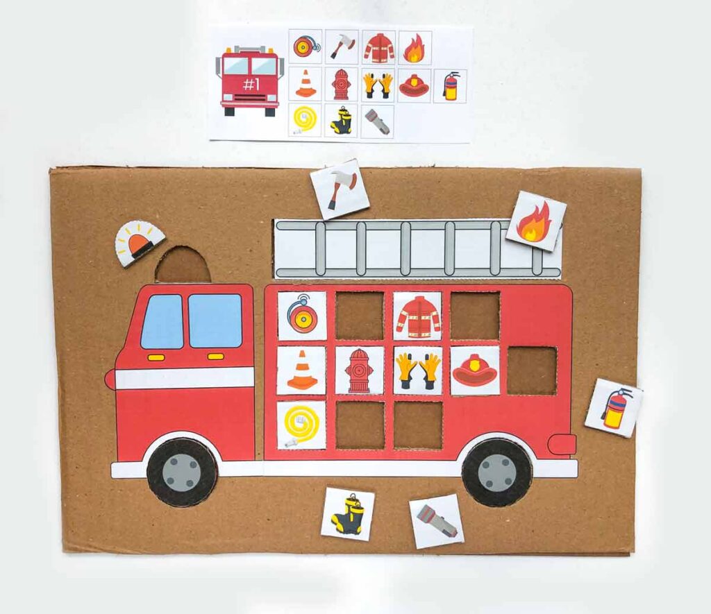 finished view of firefighter matching activity for preschoolers with challenge card #1 and some tiles in the correct slots.