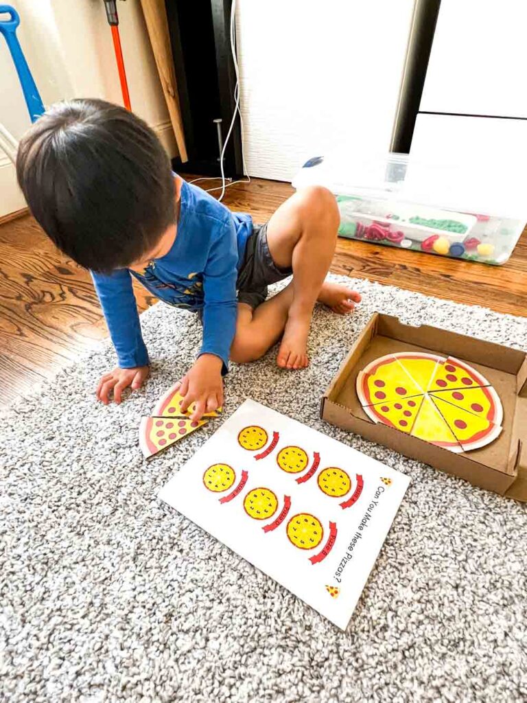 preschool kid playing with pizza counting activity