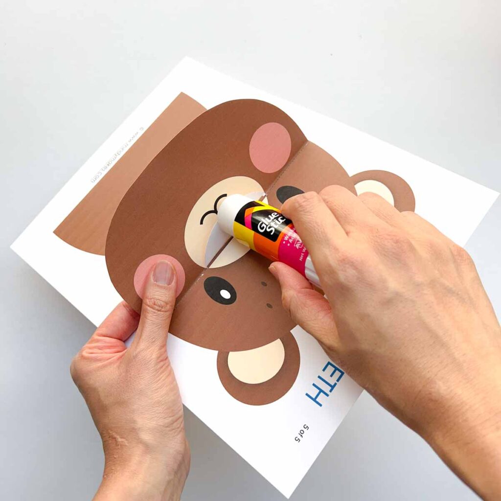 gluing nose of lift a flap to nose of printable using glue stick. Tooth Brushing Activity for Preschoolers