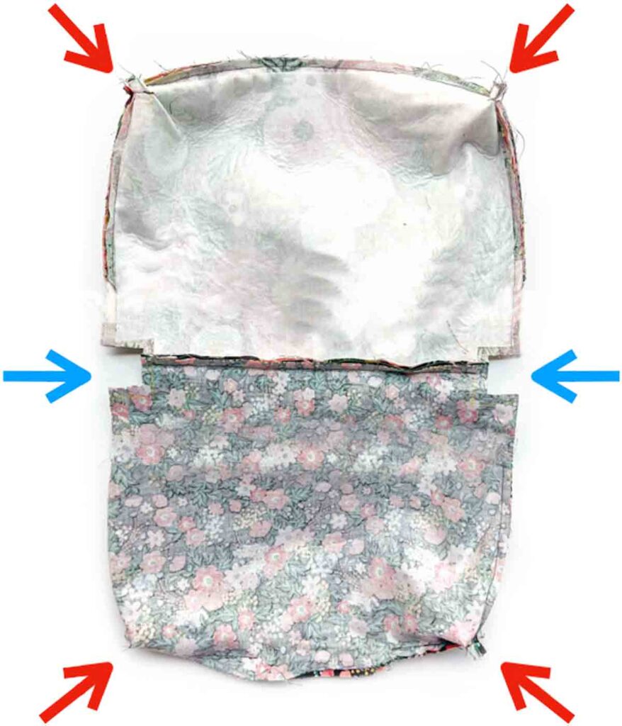 image shows 4 corners of crossbody bag boxed, with 2 more corners by the zipper that need to be boxed.