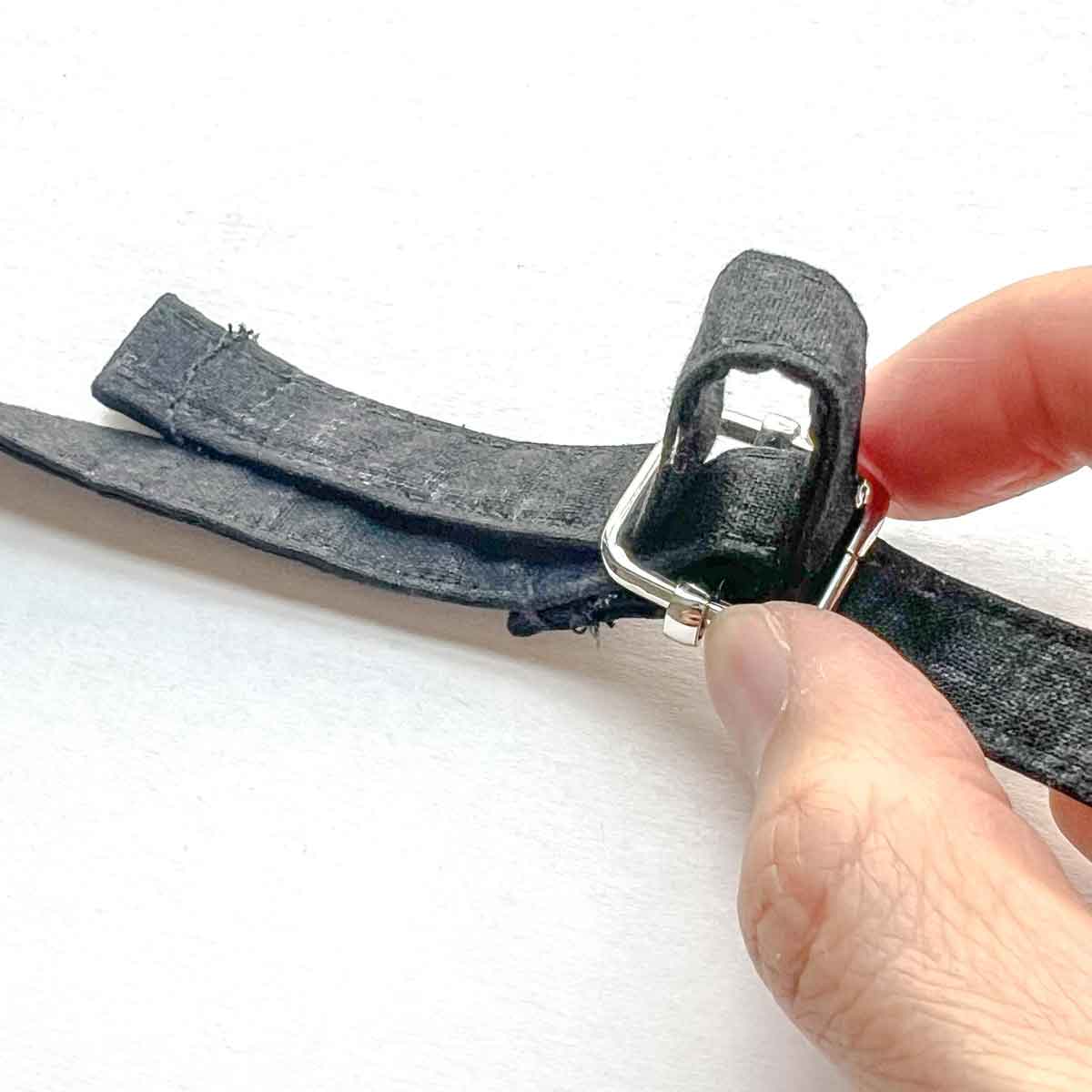 another view of bag strap looped through triglide slider