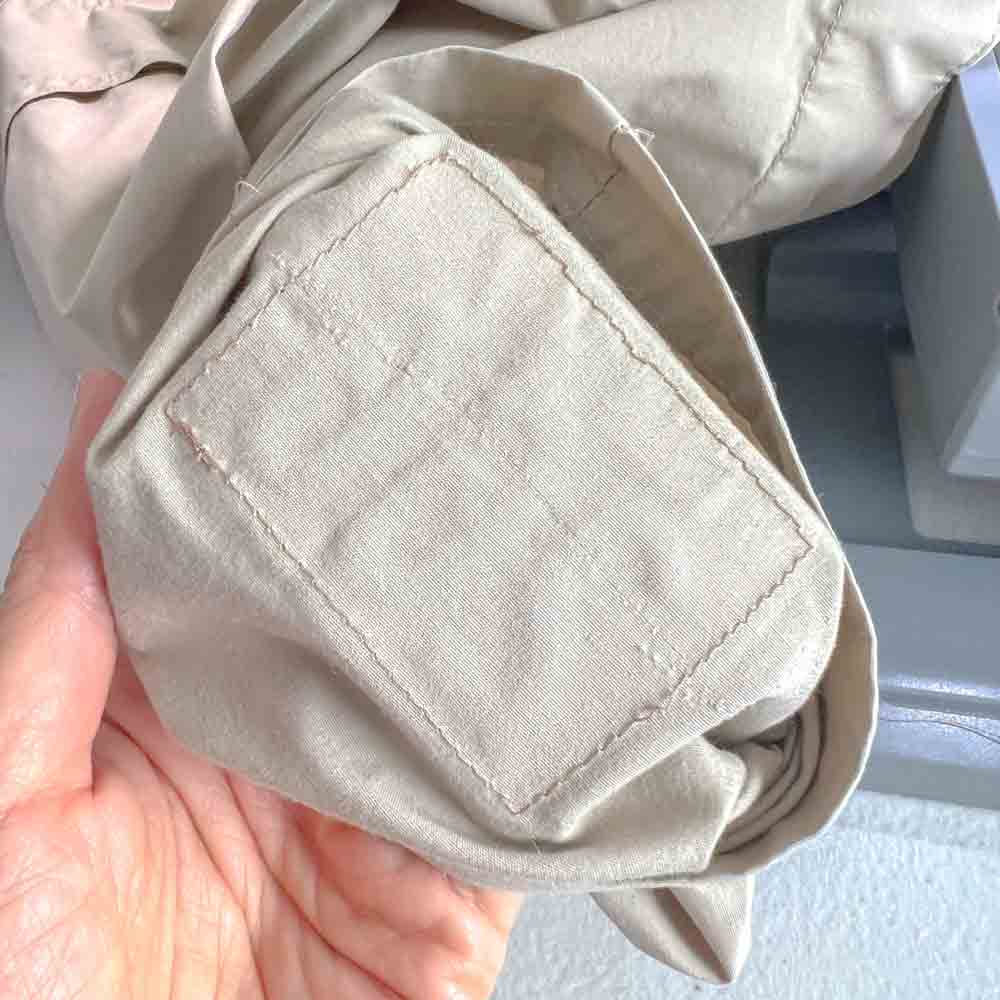 Back of uniform with stitch lines where patch is attached.