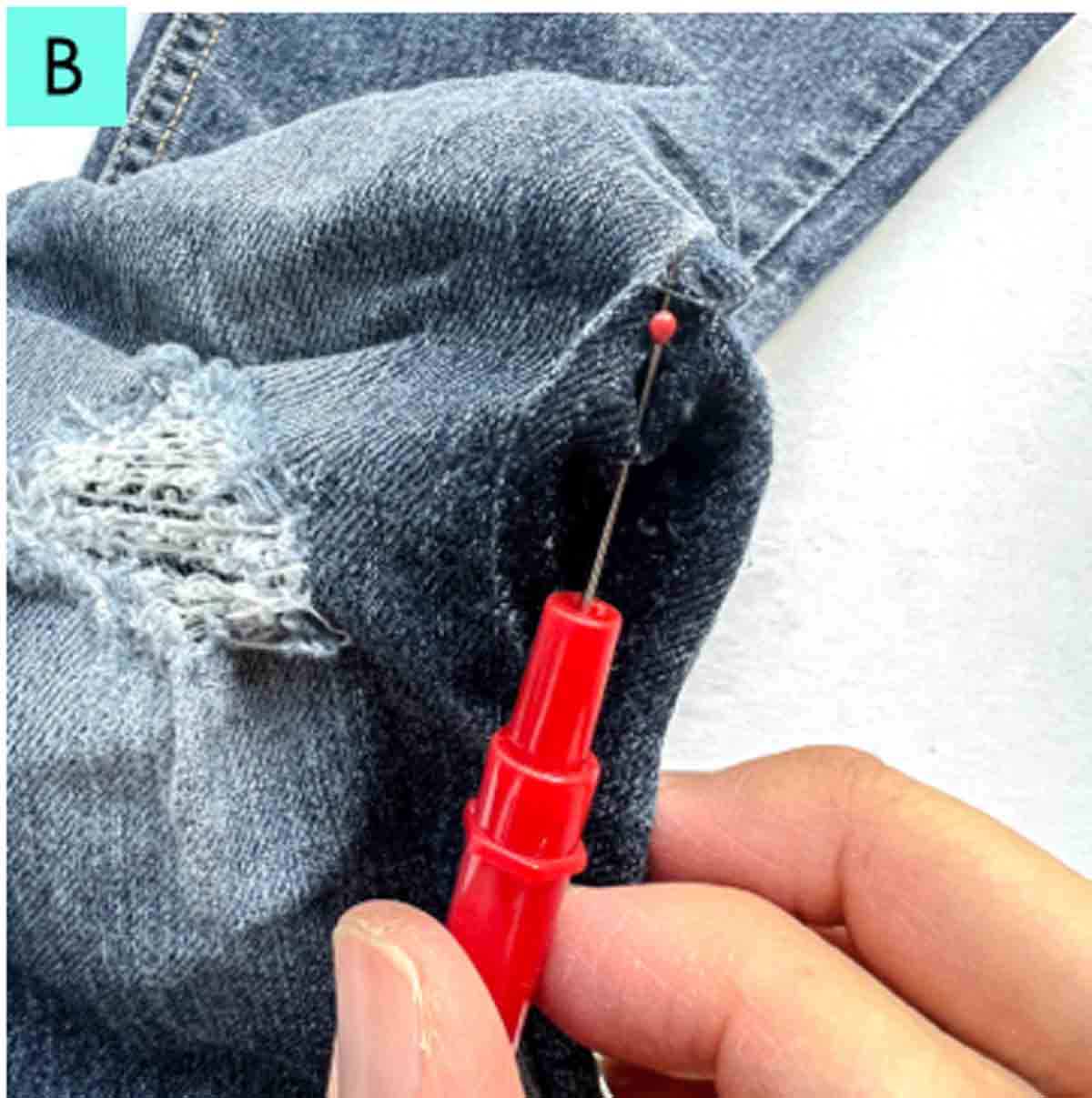 taking out side seam from pair of jeans that need mending 