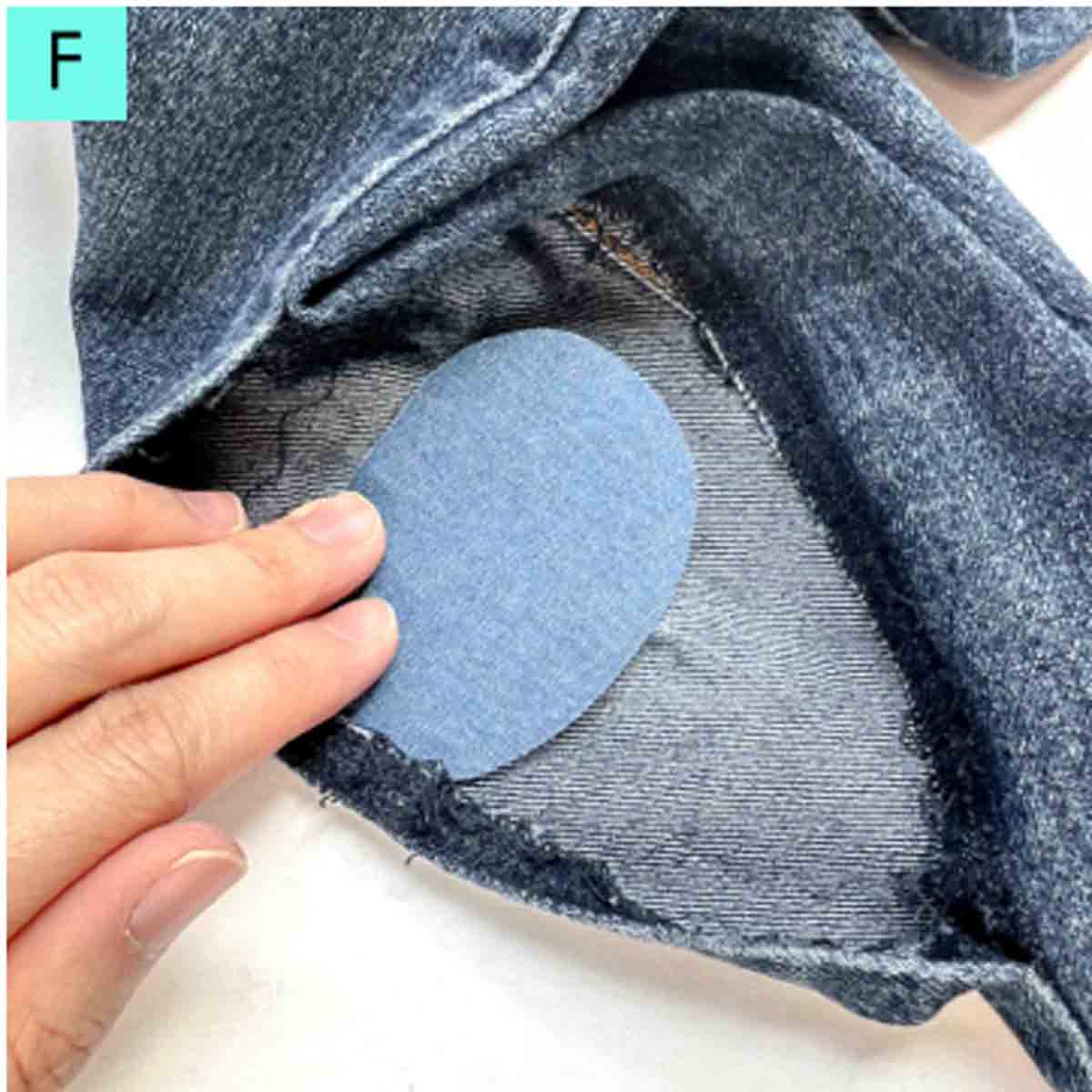 applying denim patch to inside of jeans.
