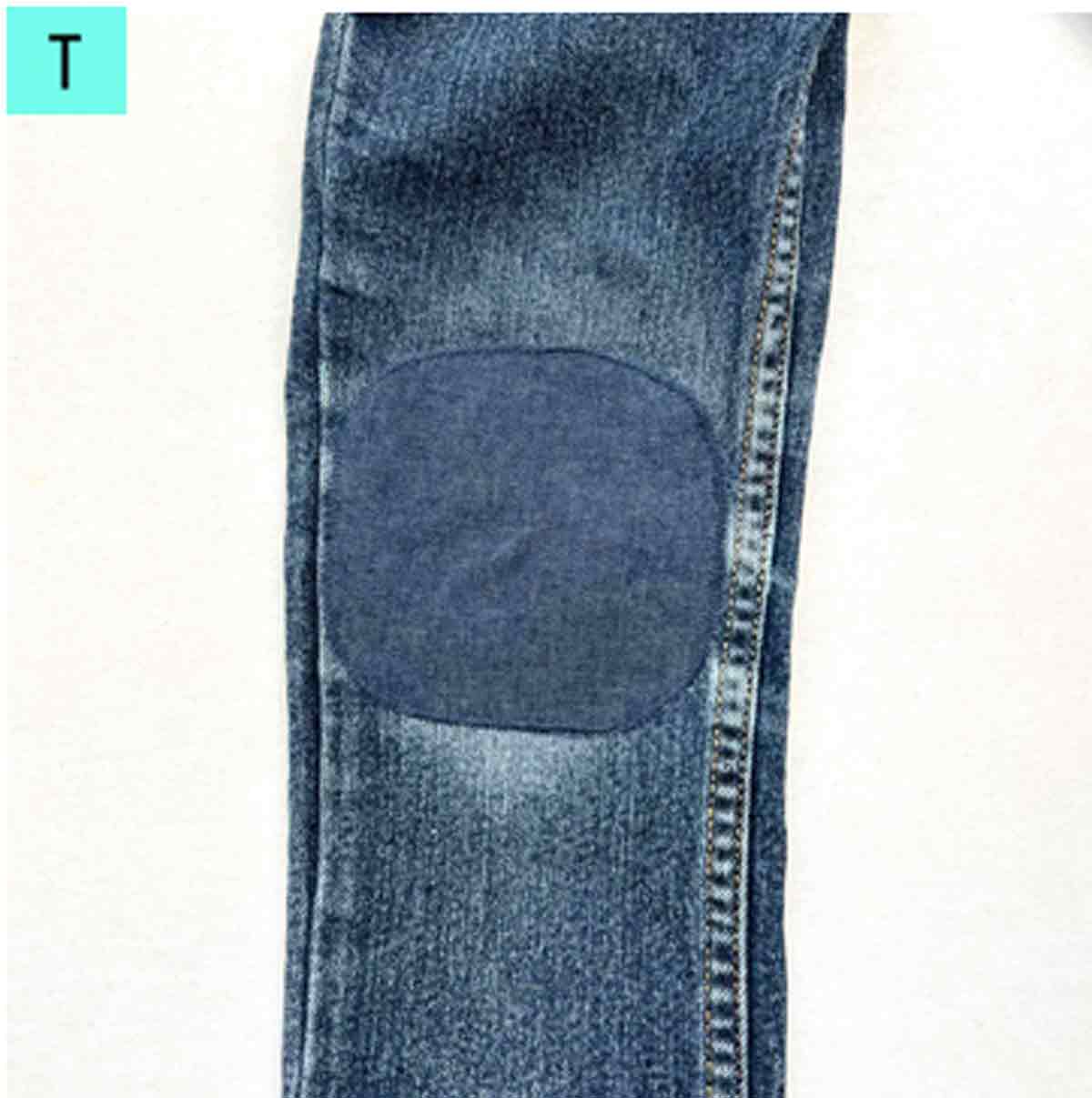 finished jeans hole repair with patch on front.
