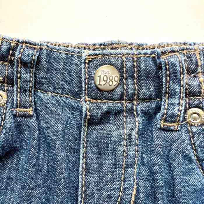 heavy duty metal snaps topside of denim pants