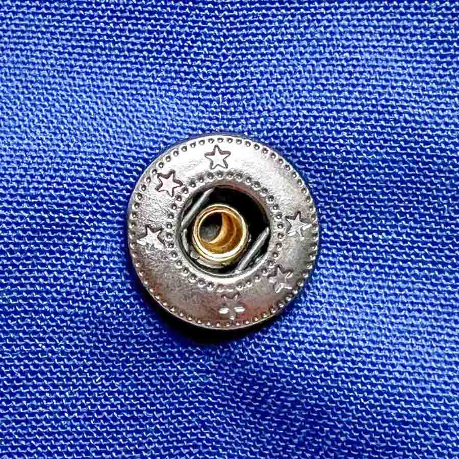 Step-by-step snap fastener installation tutorial - view of snap socket correctly installed. How to install snaps to fabric