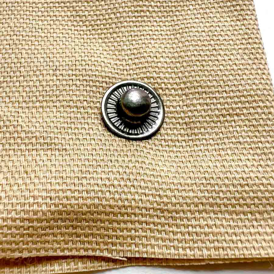 Step-by-step snap fastener installation tutorial - snap stud correctly installed onto fabric. 