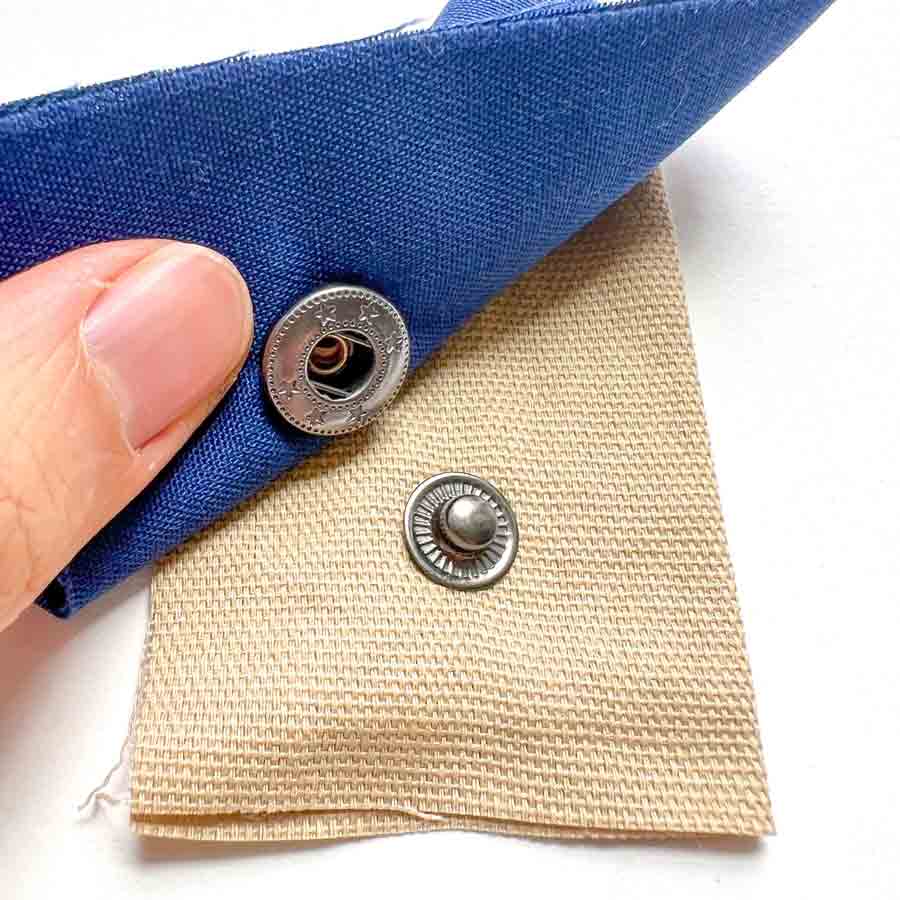 Step-by-step snap fastener installation tutorial - view of snap stud and snap socket correctly installed. How to install snaps to fabric