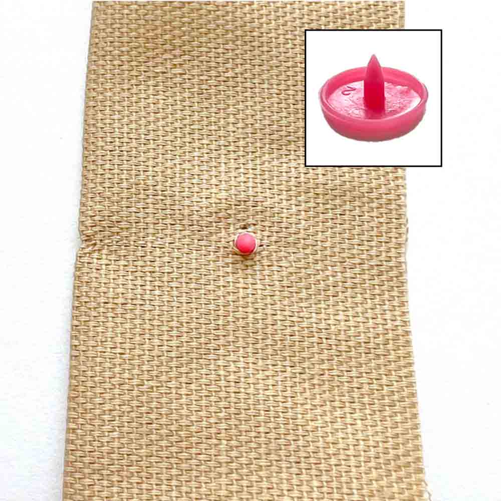 How to apply snaps to fabric using a snap press - inserting snap cap through hole in fabric. How to install snaps to fabric. 