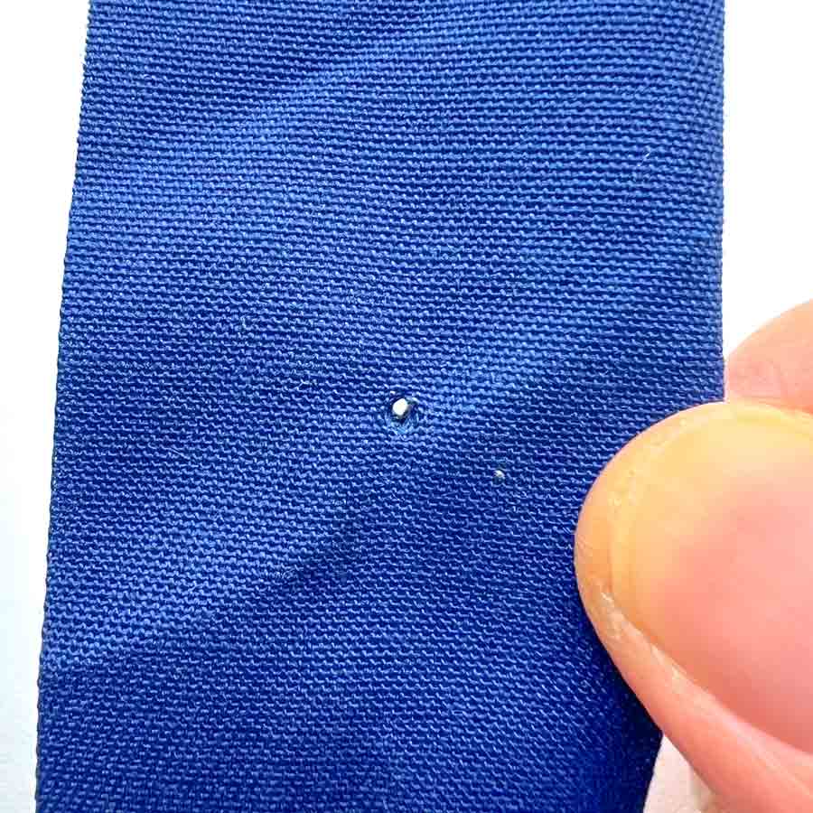 How to apply snaps to fabric using a snap press - hole in fabric.