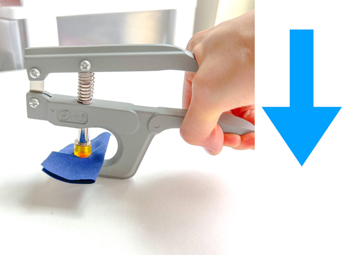 How to apply snaps to fabric using a snap press - squeezing snap pliers