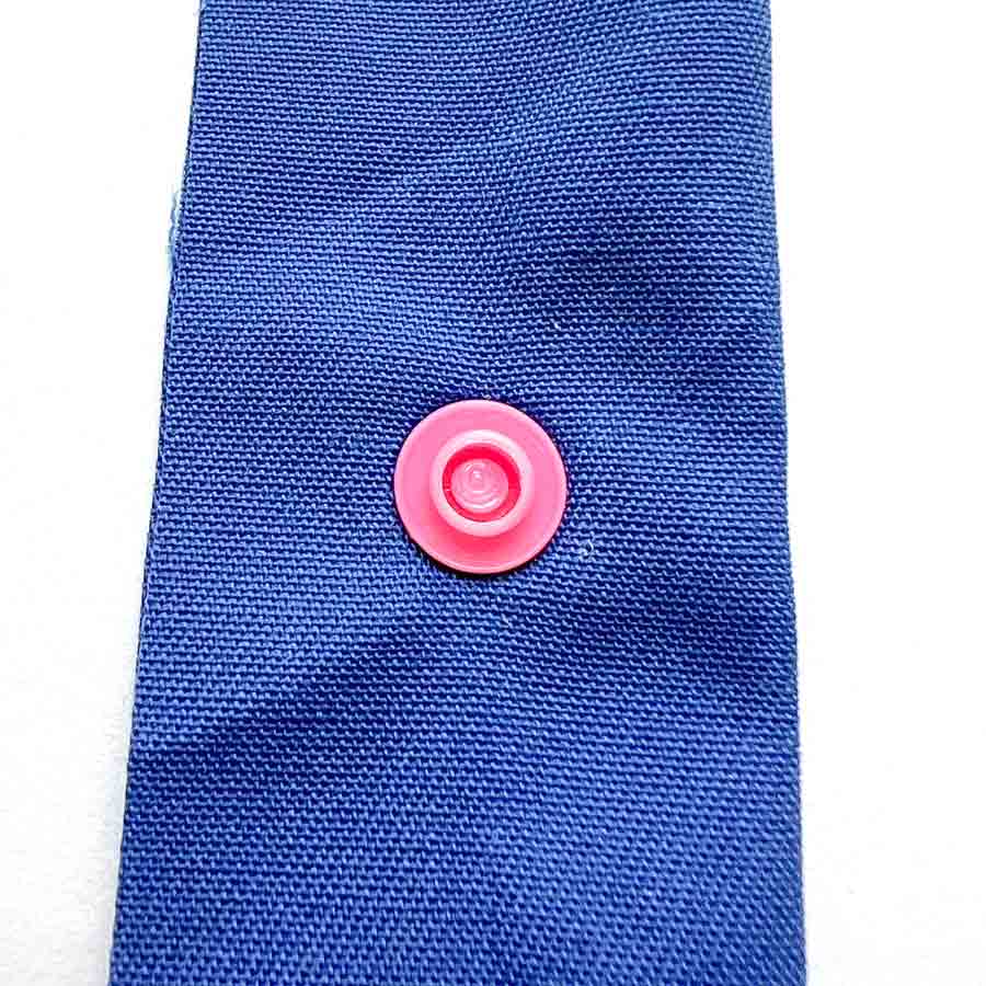 How to apply snaps to fabric using a snap press - view of snaps after it's been pressed. 