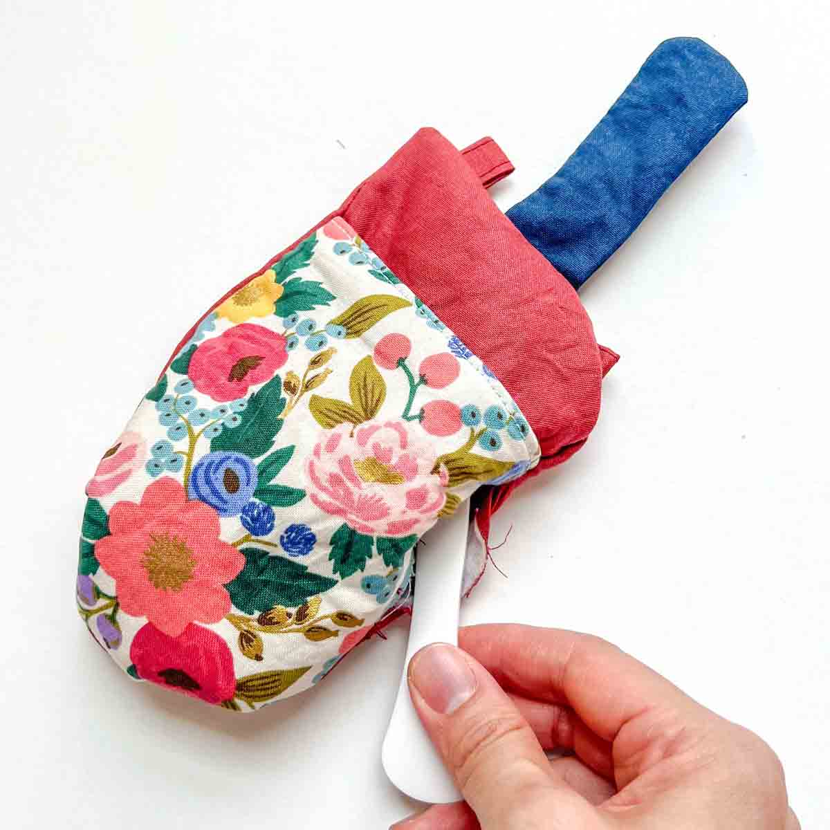 using point turner to push out corners of cell phone bag