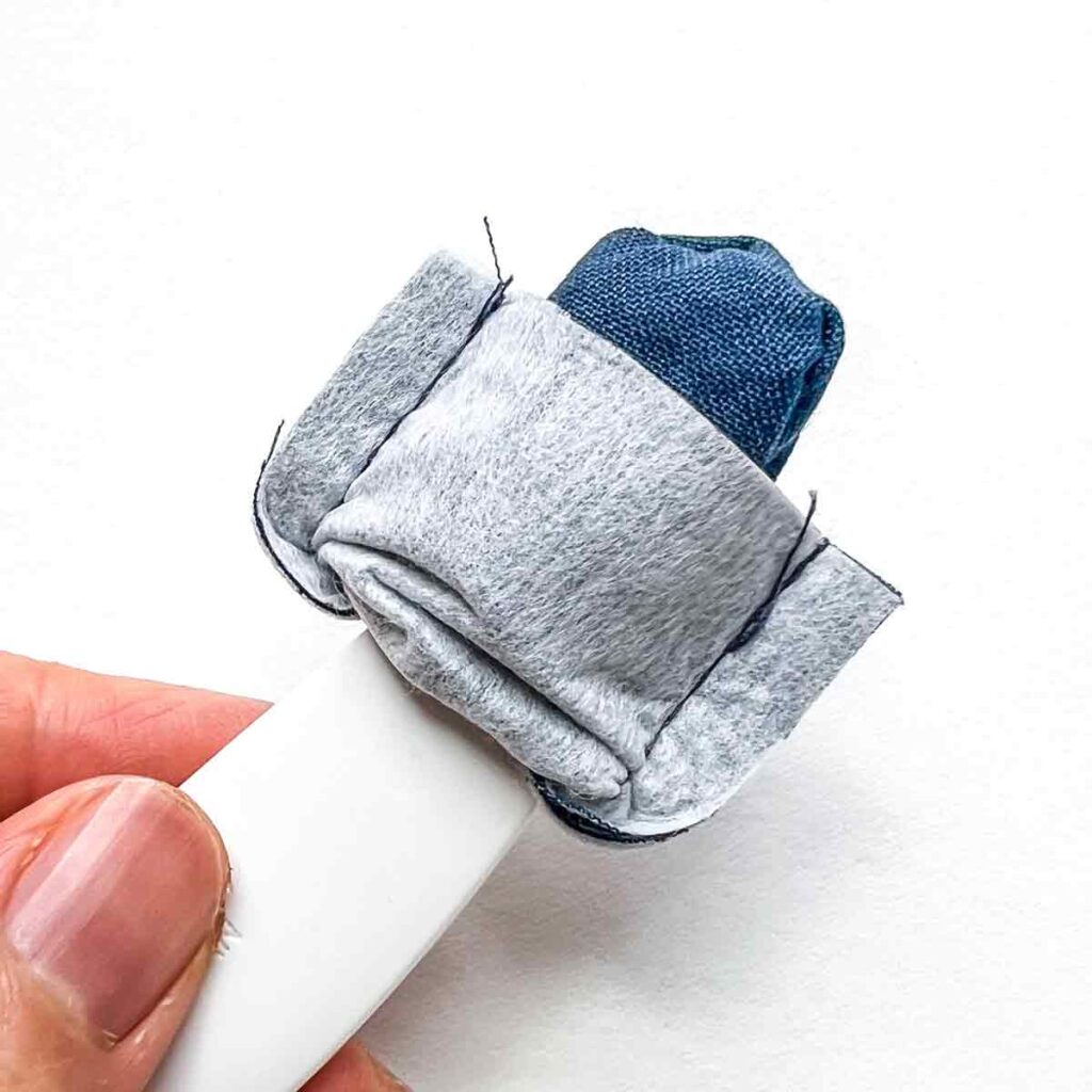 turning flap piece of crossbody cellphone bag to right side