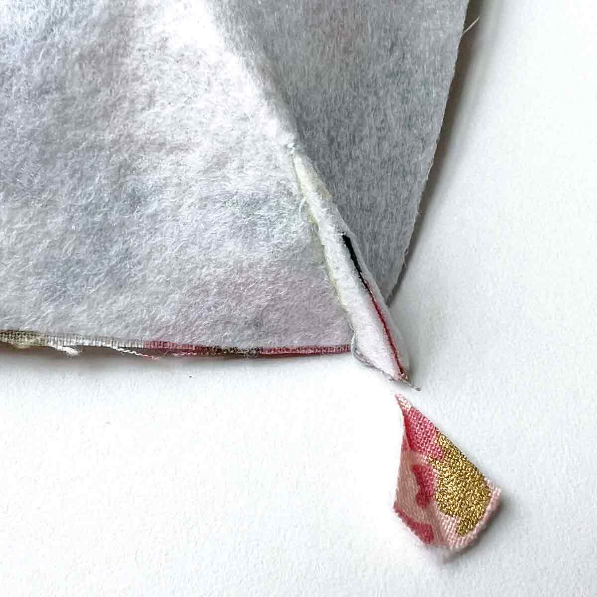 trimming darts of front pocket of cross body cell phone bag