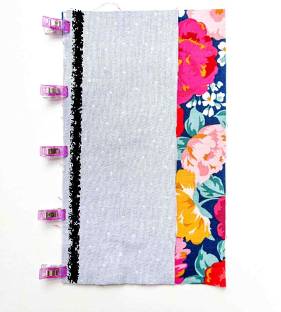 binding and front right sides together, clipped on left side with black sew line