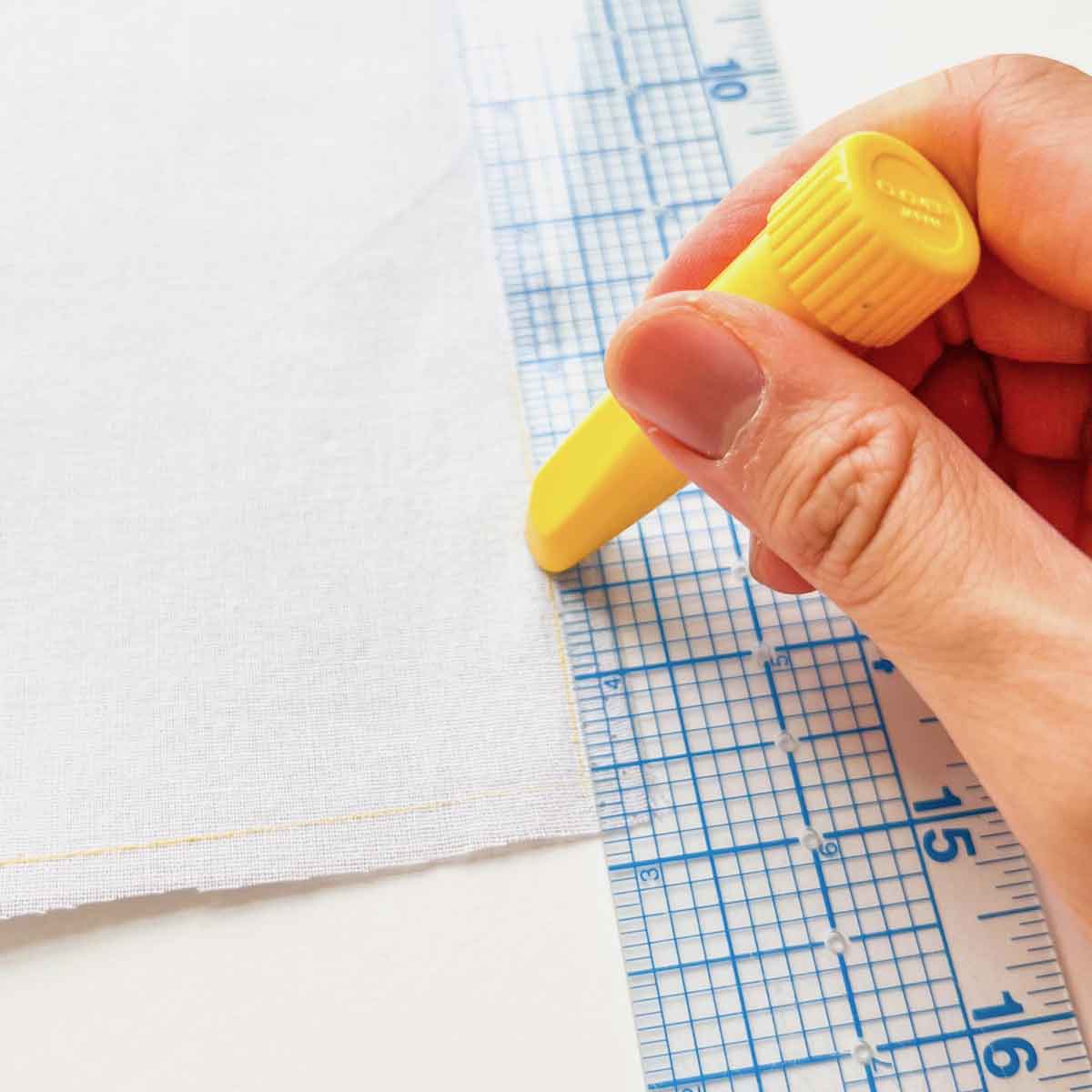 marking sew line with quilter's chalk and clear ruler on wrong side of LINING