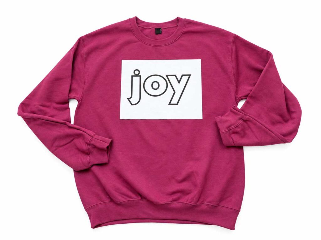 Paper template on top of plain sweatshirt 