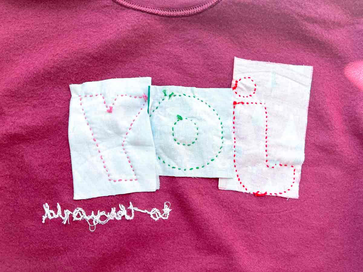 Inside view of a sweatshirt showing the fabric used for reverse appliqué