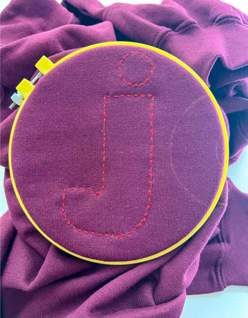 letter 'j' finished sewing on sweatshirt