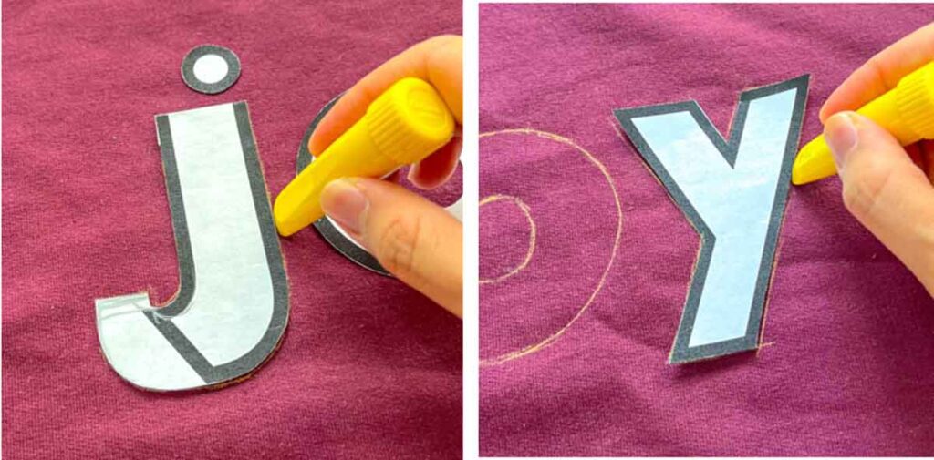 tracing lettering with fabric chalk on front of sweatshirt